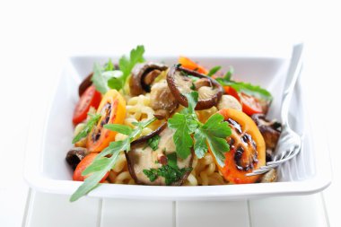 Pasta with mushrooms and tamarillos clipart