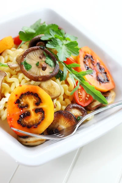 Pasta with mushrooms and tamarillos — Stock Photo, Image
