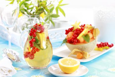 Fresh fruits served in melon bowl clipart