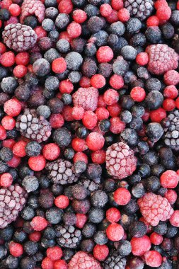 Close up of frozen mixed fruit - berries - red currant, cranberry, raspber clipart