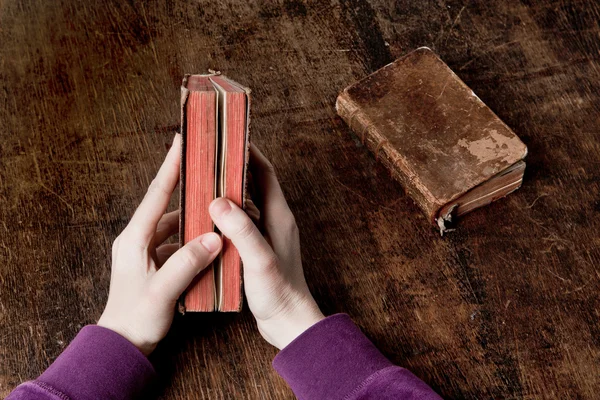 Old book in hands — Stock Photo, Image