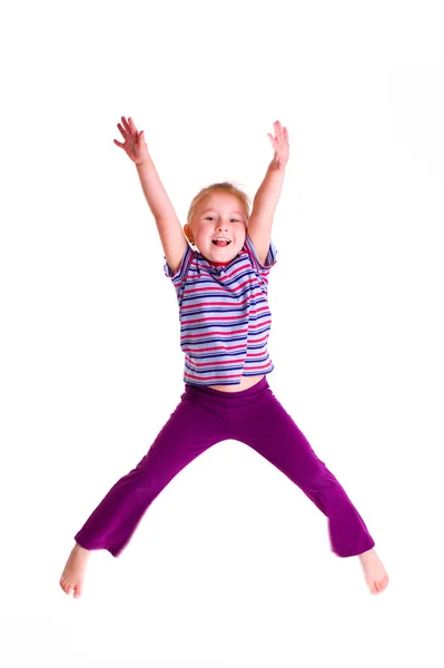 Studio shot of young girl jumping — Stock Photo, Image