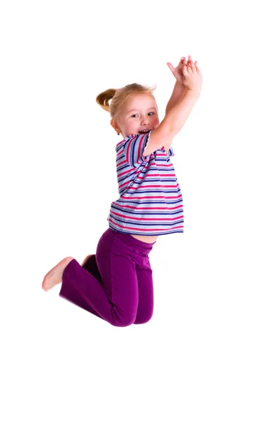 工作室拍摄的跳跃的年轻女孩 — 图库照片