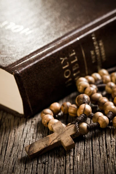 stock image Wooden rosary and the Bible