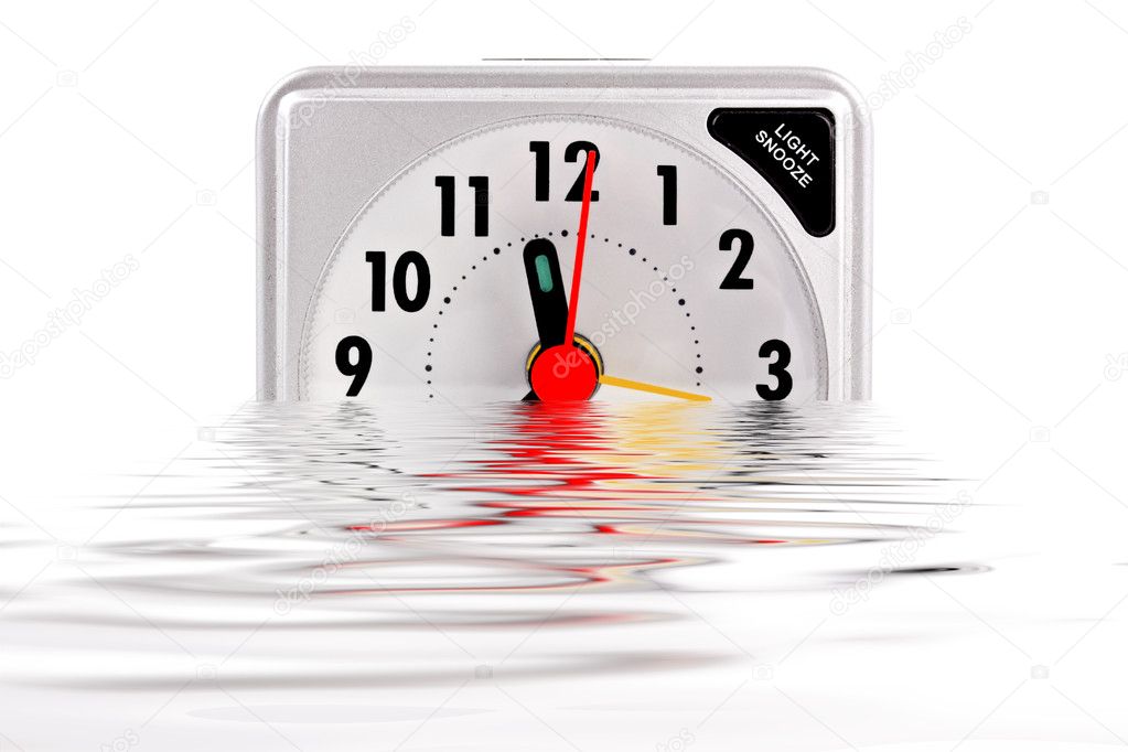 Sinking alarm clock on white background