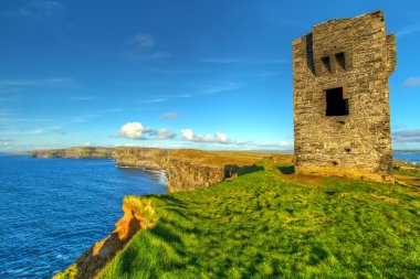 Ruins of old castle on Cliffs of Moher clipart