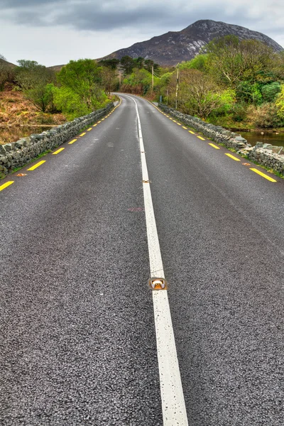 stock image Irish road with mountain view