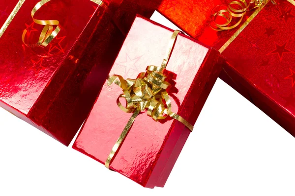 Red gift boxes with golden ribbon — Stock Photo, Image