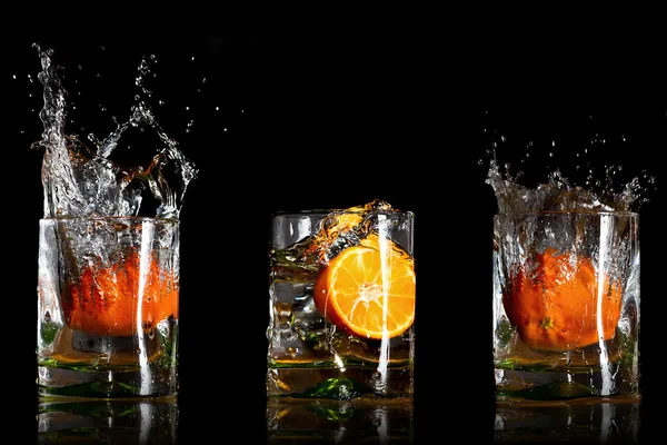 Portakal ile içecekler sıçramasına — Stok fotoğraf