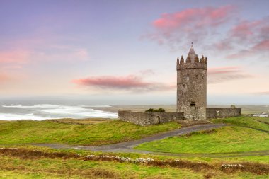 Doonagore castle at sunset clipart