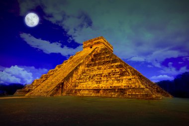 Kukulcan pyramid in Chichen Itza at full moon clipart