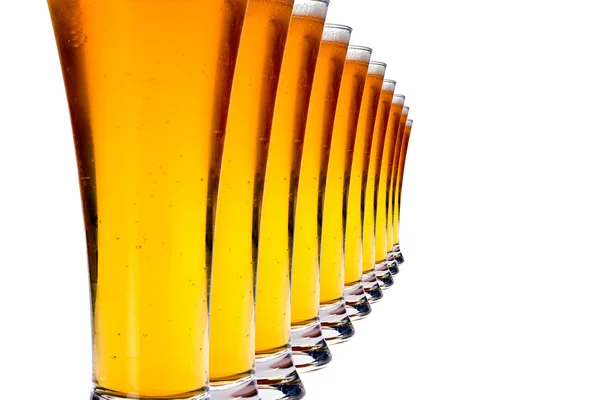 Line of glasses with lager beer — Stock Photo, Image