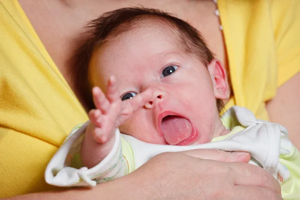 Baby girl making funny faces — Stock Photo, Image