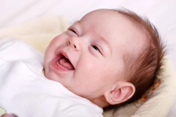 Baby girl laughing with toothless smile — Stock Photo, Image