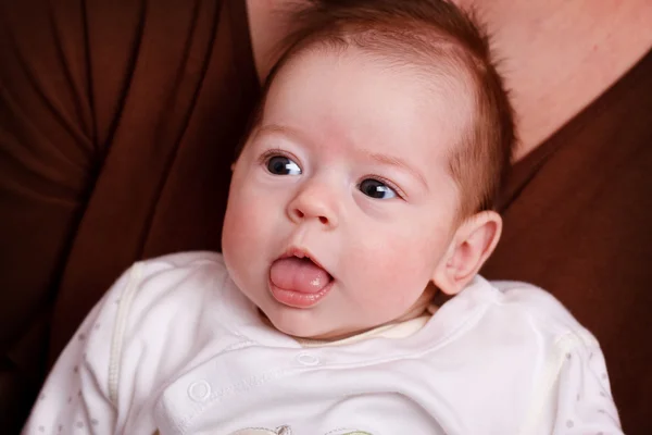 Baby girl making funny faces — Stock Photo, Image