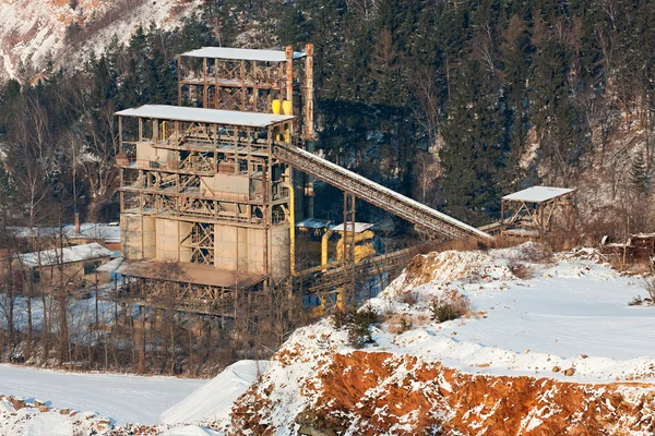 stock image Stone quarry with silos, conveyor belts in winter