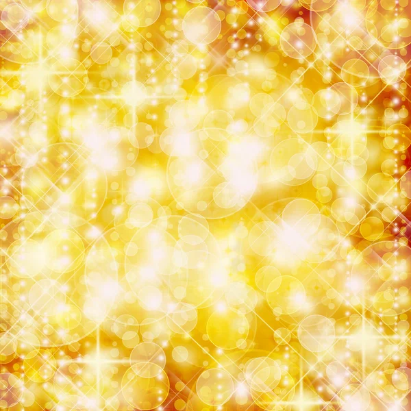 Background of defocussed golden lights with sparkles — Stock Photo, Image