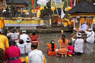 Prayers at Puru Tirtha Empul temple, Bali, Indonesia clipart