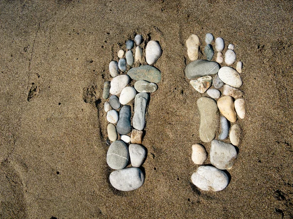 Pés de pedra na areia — Fotografia de Stock