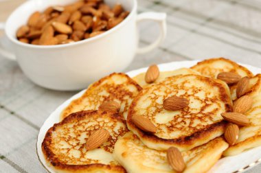 Delicious homemade pancakes with almonds clipart