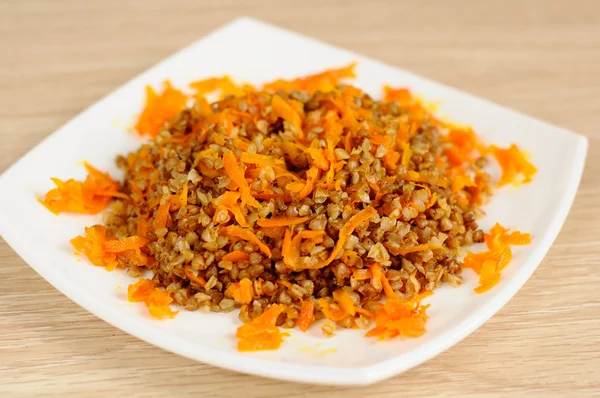 Buckwheat porridge with carrots — Stock Photo, Image