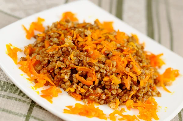 Buckwheat porridge with carrots — Stock Photo, Image