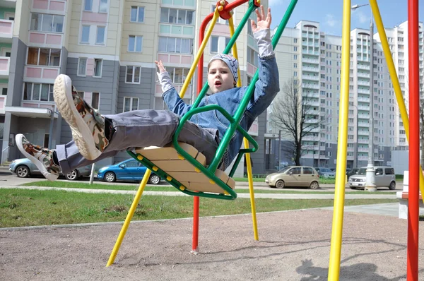 A boy on a swing — Stock Photo, Image
