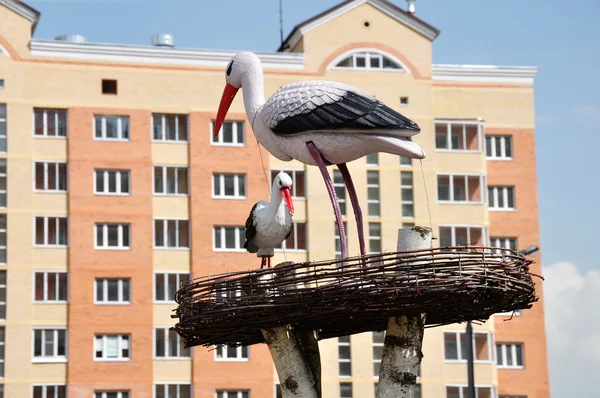 Storks in the nest - a sculpture — Stock Photo, Image