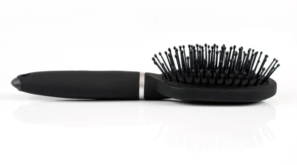 Hafif bir arka plan üzerinde siyah saç fırçası Masaj — Stok fotoğraf