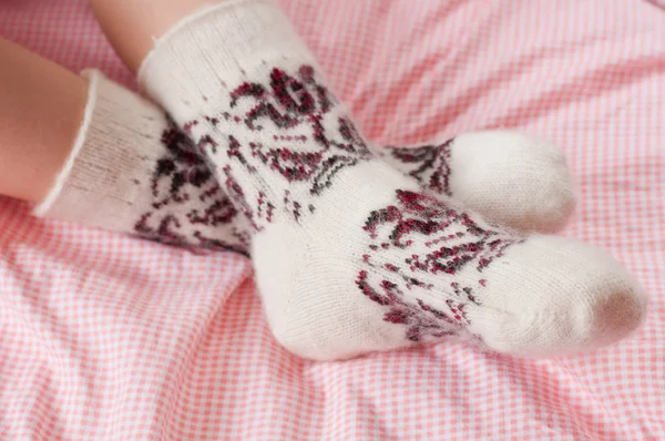 Children's feet in wool socks — Stock Photo, Image