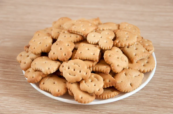 Děti si sušenky na talíři — Stock fotografie