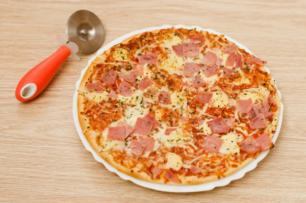 Appetizing pizza with ham — Stock Photo, Image