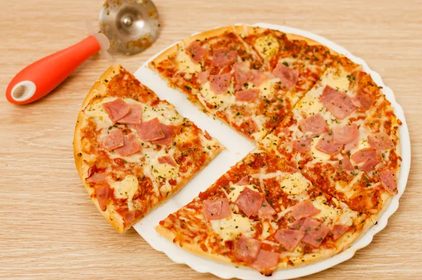 Appetizing pizza with ham — Stock Photo, Image
