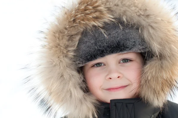 Portrait of a boy in a jacket with fur — Stock Photo, Image