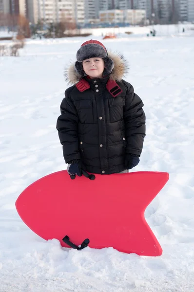 Portrait of a boy with a sledge — Stock Photo, Image