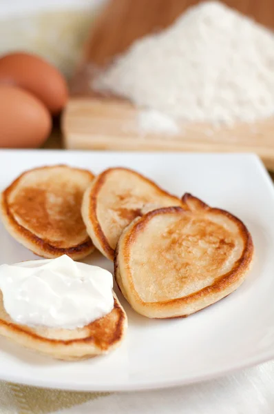 stock image Home pancakes with sour cream, flour and eggs