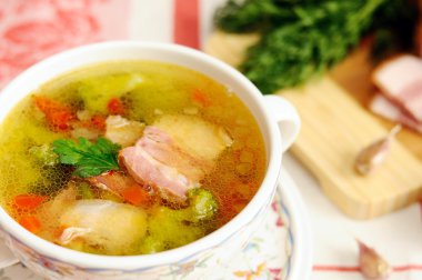 Italian soup with vegetables and bacon clipart