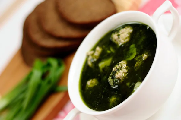 Soup with spinach and meatballs — Stock Photo, Image