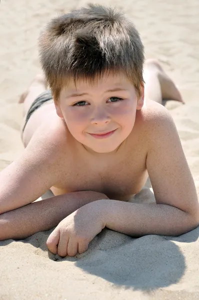 stock image The boy on the beach