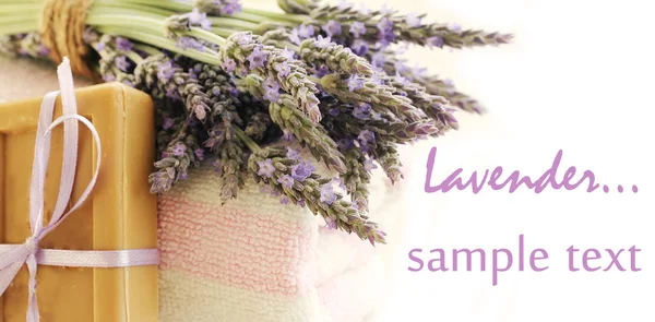 Soap ,towels and Lavender flowers isolated on white — Stock Photo, Image