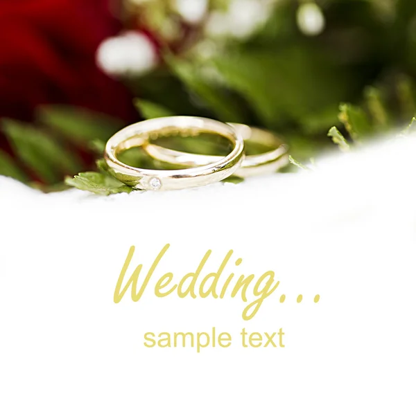 stock image Wedding rings and roses bouquet isolated,very shallow dof