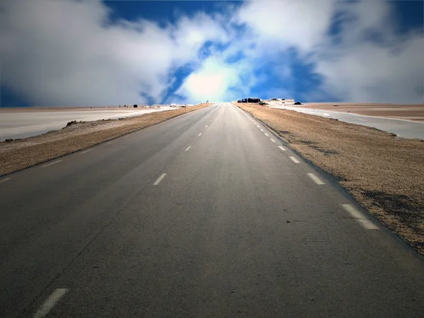 stock image Desert highway along a salt lake