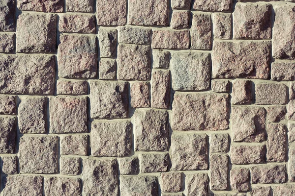 Een muur van stenen blokken — Stockfoto
