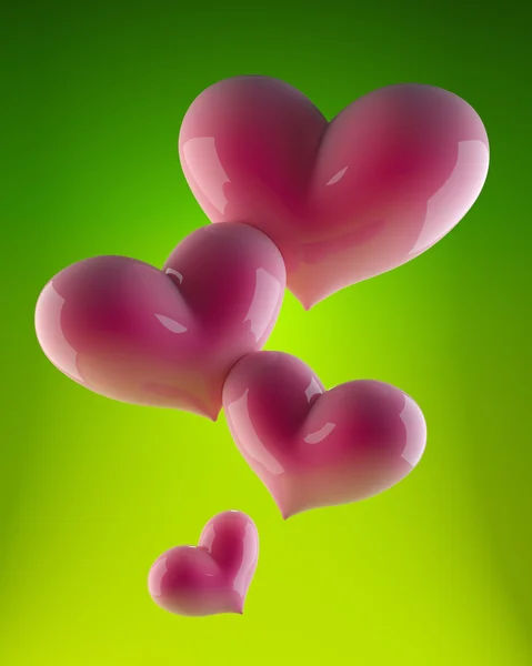4 růžové srdce na zelené — Stock fotografie