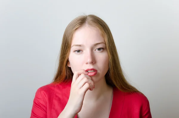 Pensive woman in red — Stock Photo, Image