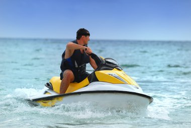 Man drive on the jetski clipart