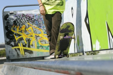 Skateboarder On a Skate Ramp clipart