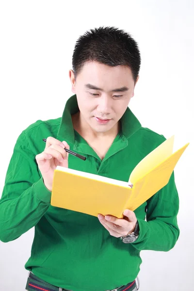 Student reading a book with a white background. Royalty Free Stock Photos