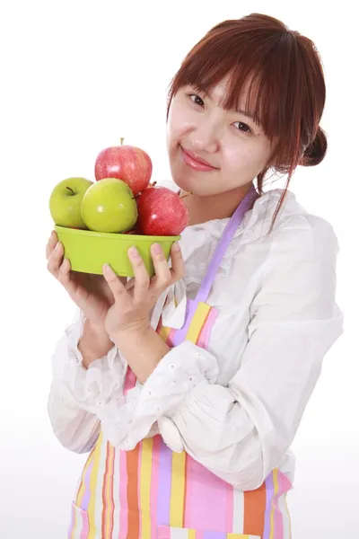Een chinese vrouw met vruchten op witte geïsoleerd. — Stockfoto