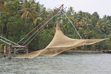 Chinese fishing nets at back waters of Kerala clipart